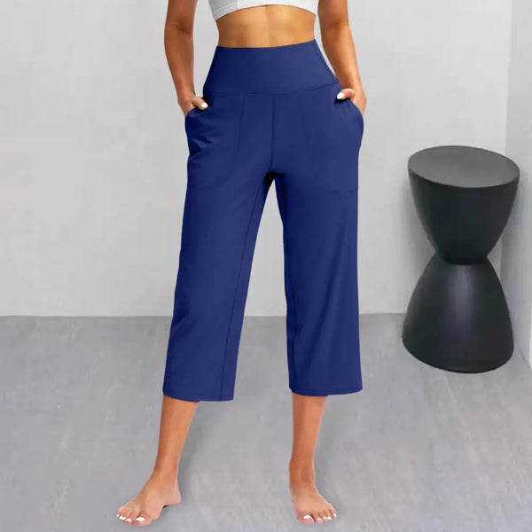 Chic high-waist wide-leg capri yoga pants with pockets, perfect for activewear and casual outings in nylon-spandex blend.
