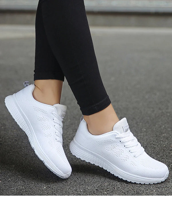White running shoes with multi-color details and secure lace closure