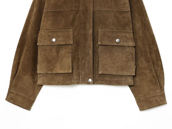 Chic women's leather jacket with button closure, lapel collar, short length, perfect for autumn fashion and urban style.