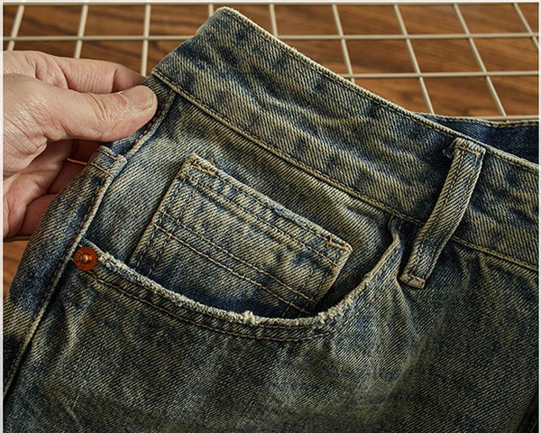 Back pocket detail of Rebel Spirit Distressed Jeans, highlighting classic design elements.