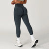 Gray seamless yoga leggings for women, made from nylon-spandex blend.