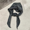 Floral and striped triangle scarf for versatile styling.