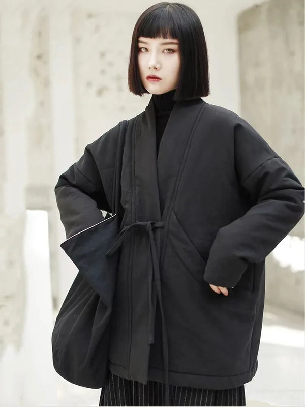 Side view of oversized winter jacket featuring adjustable belt and spacious pocket design
