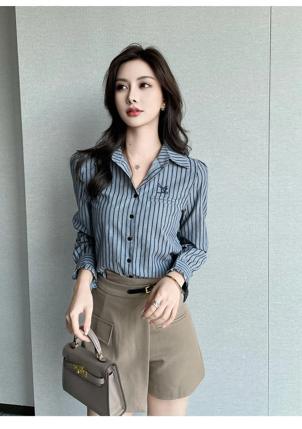 Chic striped blouse for office elegance, featuring a turn-down collar and single-breasted button front for professional style