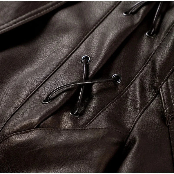 Chic belted leather bomber jacket for women, featuring lace-up detail, hood, and notched lapel, perfect for autumn and winter