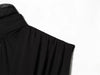 Detail view of pleated texture on sleeveless black top with ribbon