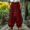 Wine red wide leg trousers with decorative lace-up front and flowing silhouette