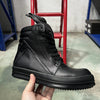 Unisex black leather high-top sneakers with zip closure