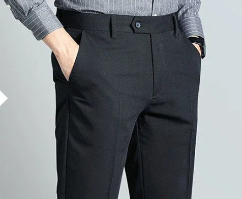 Elegant slim fit men's suit trousers in black, perfect for business and formal occasions, crafted from cotton-polyester blend