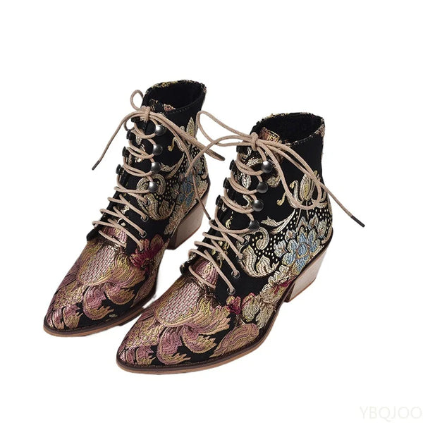 Tan ankle boots showcasing delicate floral embroidery and comfortable low heel design