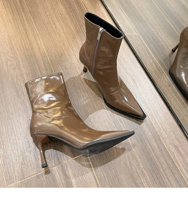 Chic women's ankle boots with zipper, high heel, pointed toe, and PU leather for stylish autumn and winter fashion.