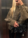Chic women's leather jacket with button closure, lapel collar, and short length for stylish urban fashion and versatility.