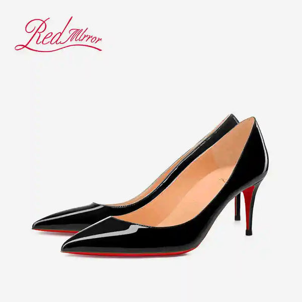Elegant black party pumps with pointed toe and dramatic height