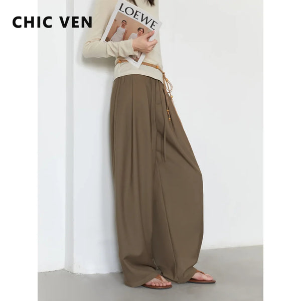 Wide leg pleated trousers in flowing polyester rayon blend with adjustable drawstring waist