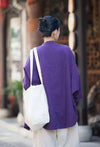 Minimalist stand collar coat in breathable cotton-linen for versatile styling