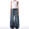 Trendy washed and ripped wide-leg women's jeans with ink-splashed finish, mid-rise, and comfortable cotton-spandex blend.