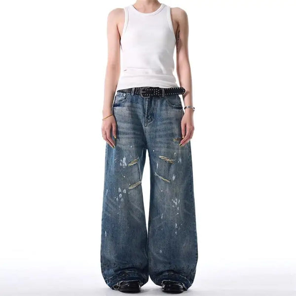 Trendy washed and ripped wide-leg women's jeans with ink-splashed finish, mid-rise, and comfortable cotton-spandex blend.