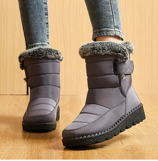 Chic women's waterproof winter boots with plush lining, low heel, and hook-and-loop closure for stylish cold weather comfort.