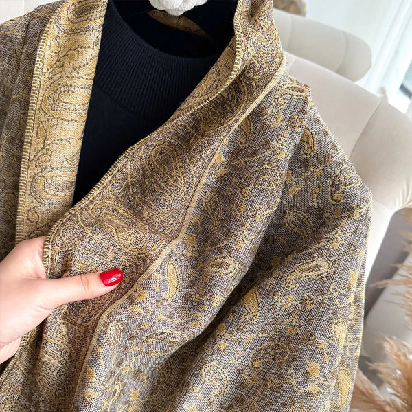 Elegant pashmina shawl wrapped around shoulders, showcasing its size.
