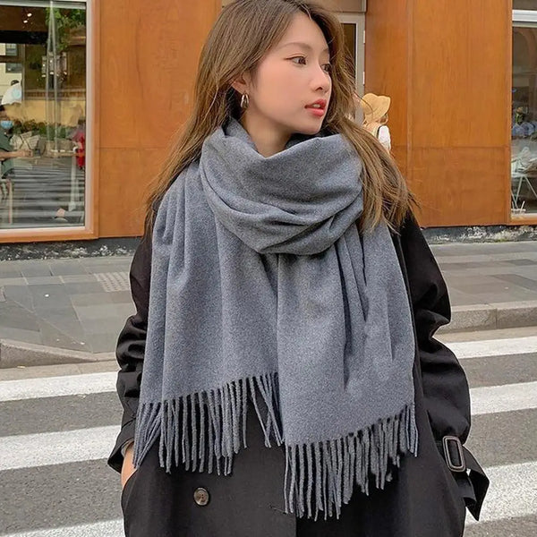 Versatile black scarf for women, can be styled as a shawl or neck scarf.