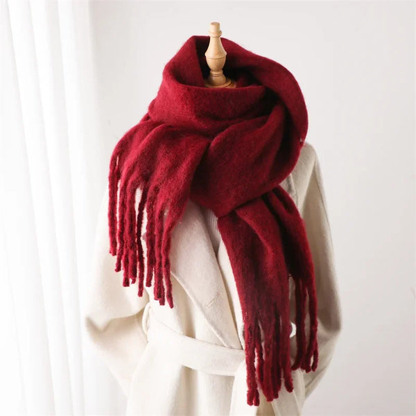 Stylish winter wrap in soft ivory, featuring plush fabric.