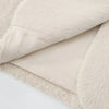 Side profile of woman wearing creamy white mohair blazer with classic collar styling