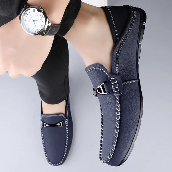 Premium brown leather loafers for men with breathable mesh lining.