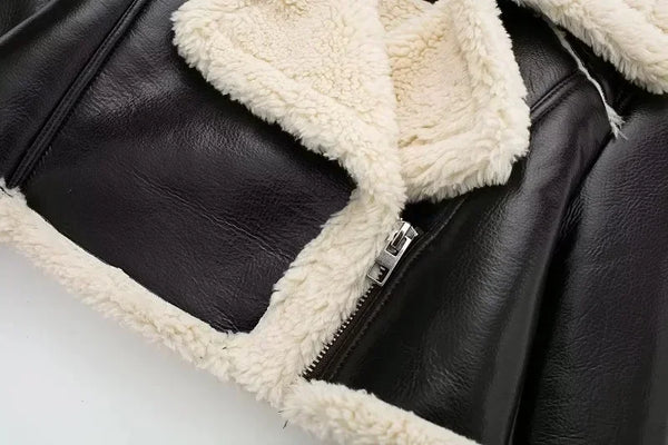 Chic cropped leather and wool blend jacket for women with fur trim, zipper closure, and turn-down collar for fall and winter.