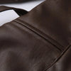 Chic belted leather bomber jacket for women, featuring lace-up detail, hood, and notched lapel, perfect for autumn and winter