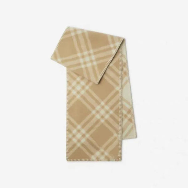 Elegant checkered scarf laid flat, emphasizing its chic design and quality material.