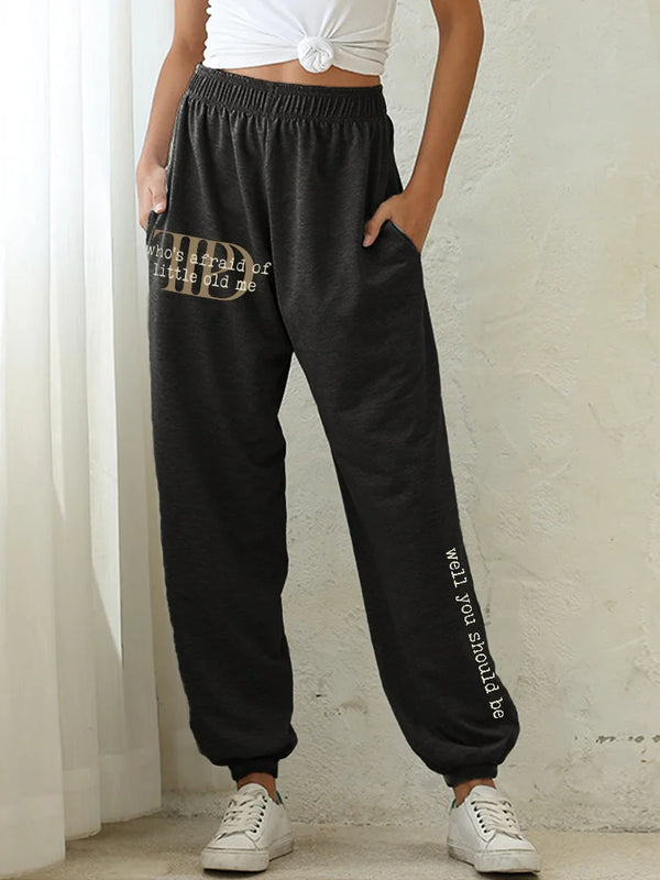 Chic high-waist joggers with 3D print, pockets, and elastic drawstring for comfort and style in any casual setting.