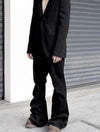 Midnight Voyager jeans styled with a trendy jacket for a stylish urban look.