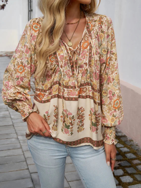 Bohemian Lace-Up V-Neck Blouse for women in vibrant print, featuring lantern sleeves and a loose fit, perfect for spring and