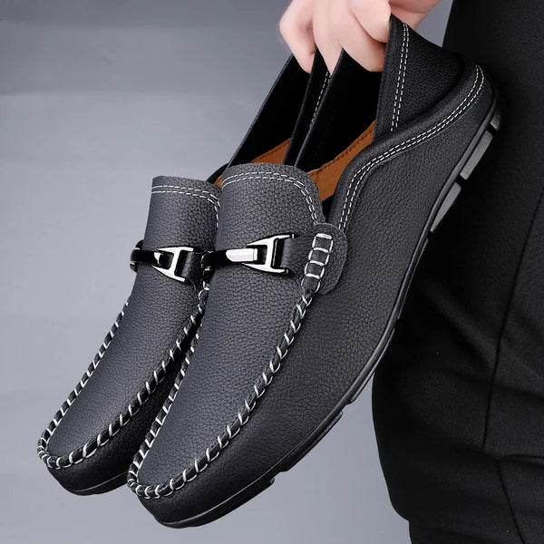 Elegant grey leather loafers for men, perfect for smart-casual occasions.