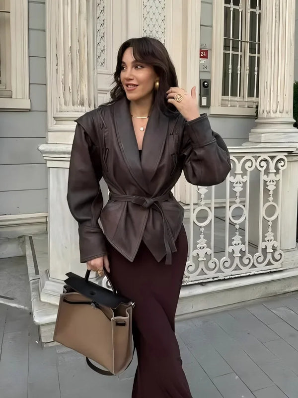 Chic belted leather bomber jacket for women, featuring lace-up detail, hood, and notched lapel, perfect for autumn and winter