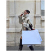 Women's khaki trench coat with double-breasted styling and tailored cut
