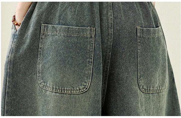 Vintage embroidered wide-leg jeans for women, featuring ethnic embroidery and elastic waist for comfort and style.