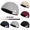 Brimless docker hat in black featuring customizable adjustable sizing