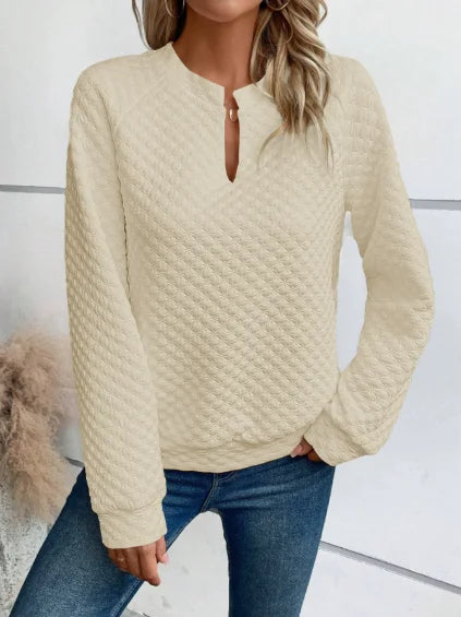 Soft knit hoodie with feminine deep V-neckline and easy drape