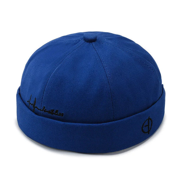 Urban Edge brimless hat in black with subtle embroidery detail