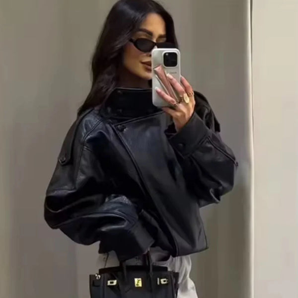 Chic black faux leather moto jacket for women, perfect for autumn evenings and stylish casual wear. Durable and fashionable.
