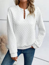 Cozy pullover hoodie featuring deep V-neck and regular length