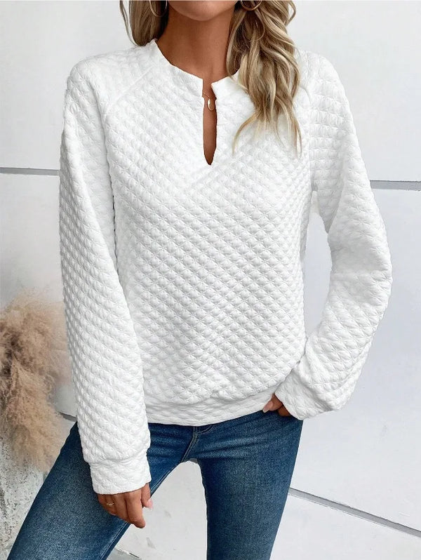 Cozy pullover hoodie featuring deep V-neck and regular length