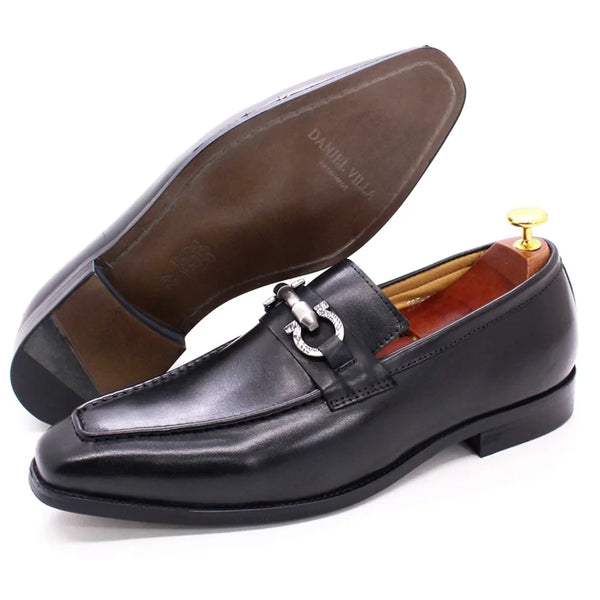 Pair of black formal loafers showing custom-fit leather construction