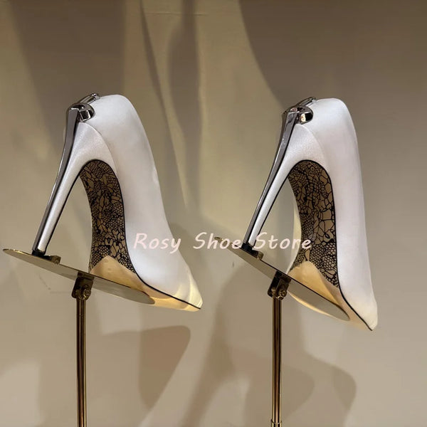 Detailed view of the scepter heel on crystal-embellished pumps.
