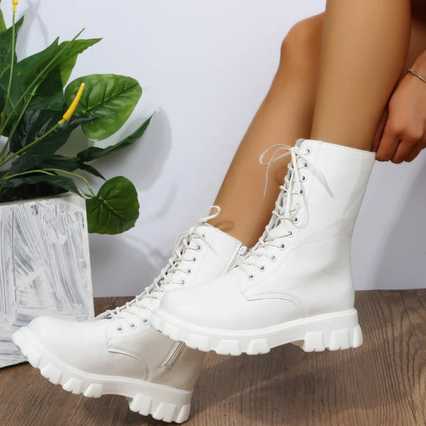 Chic white ankle boots with chunky heel, lace-up closure, and durable PU leather for stylish fall/winter outfits.