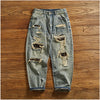 Rebel Spirit Distressed Jeans styled with hiking boots for an adventurous outfit.