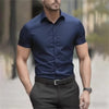 Professional man at networking event wearing versatile short sleeve stretch dress shirt