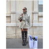 Sophisticated khaki trench with distinctive collar and structured waist