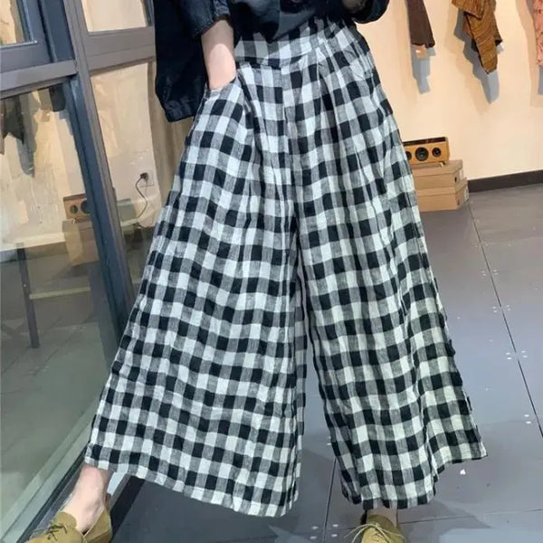 Chic plaid wide-leg pants in cotton-linen blend, featuring a high waist, pockets, and elastic waistband for comfort and style